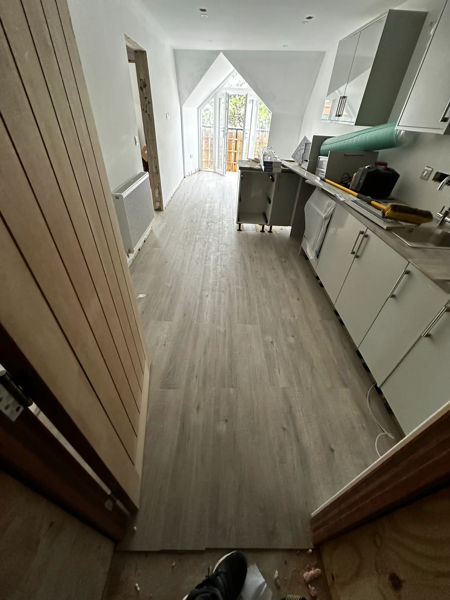 Luxury vinyl flooring fitted neatly in living room