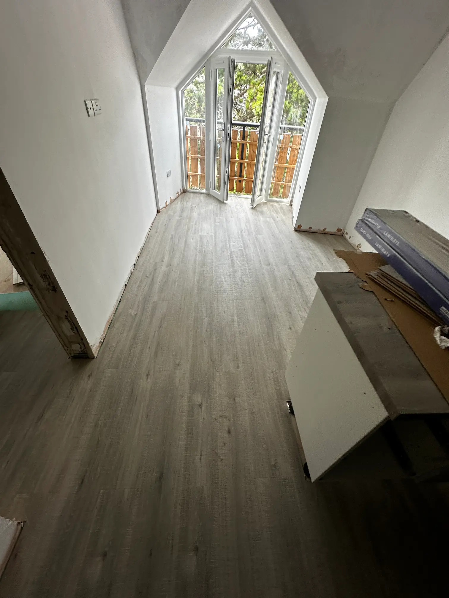 Modern flooring installation with wood effect finish