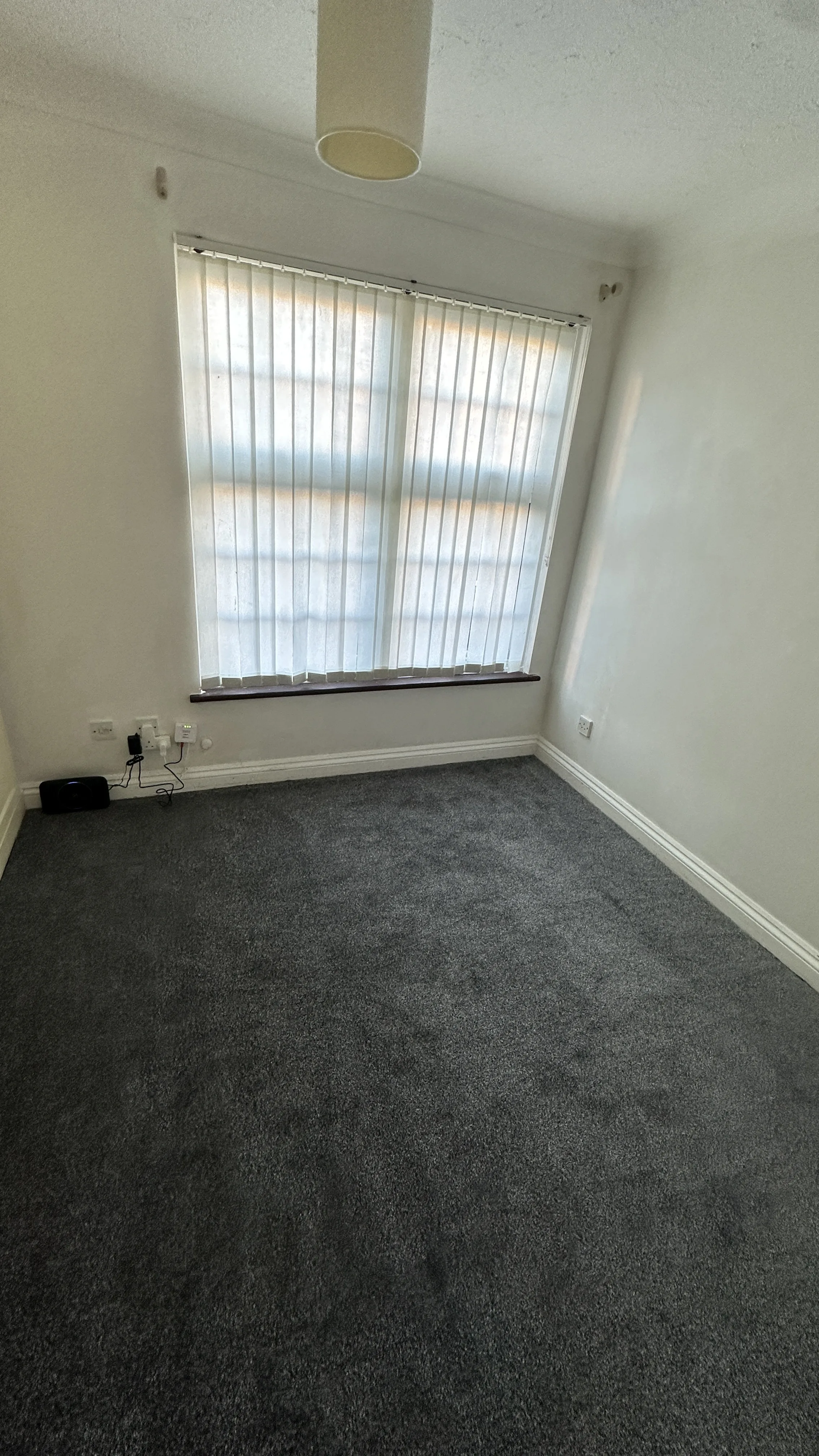 Flooring Installation project in Didcot - room with a window and a carpet
