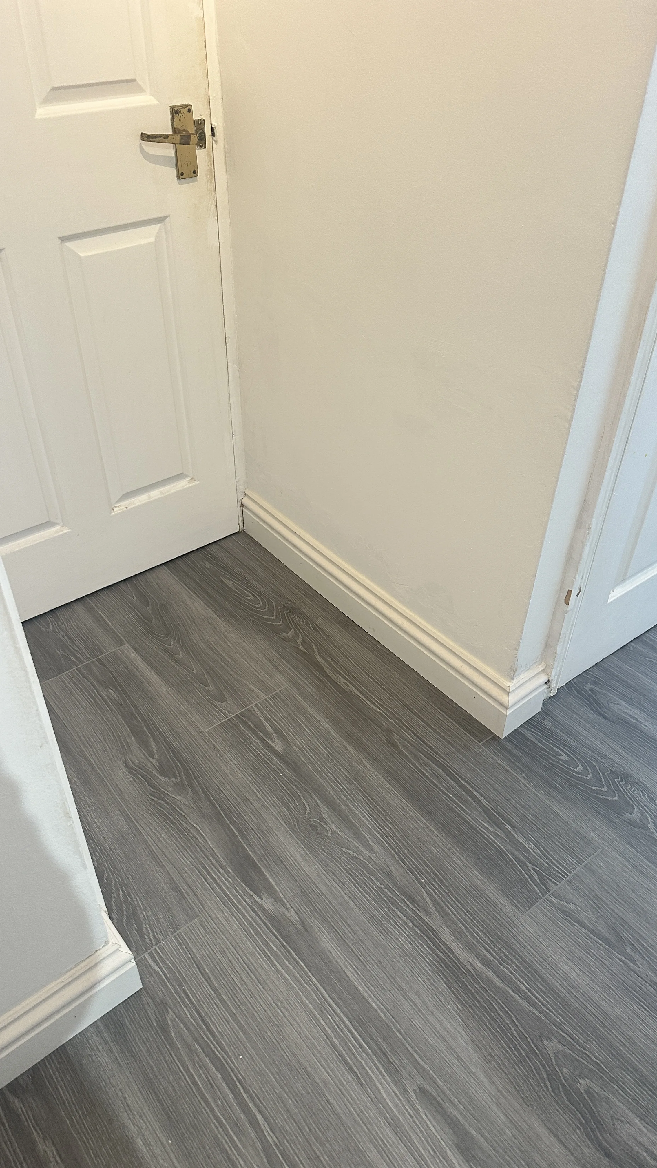 Flooring Installation project in Didcot - white door with a black handle